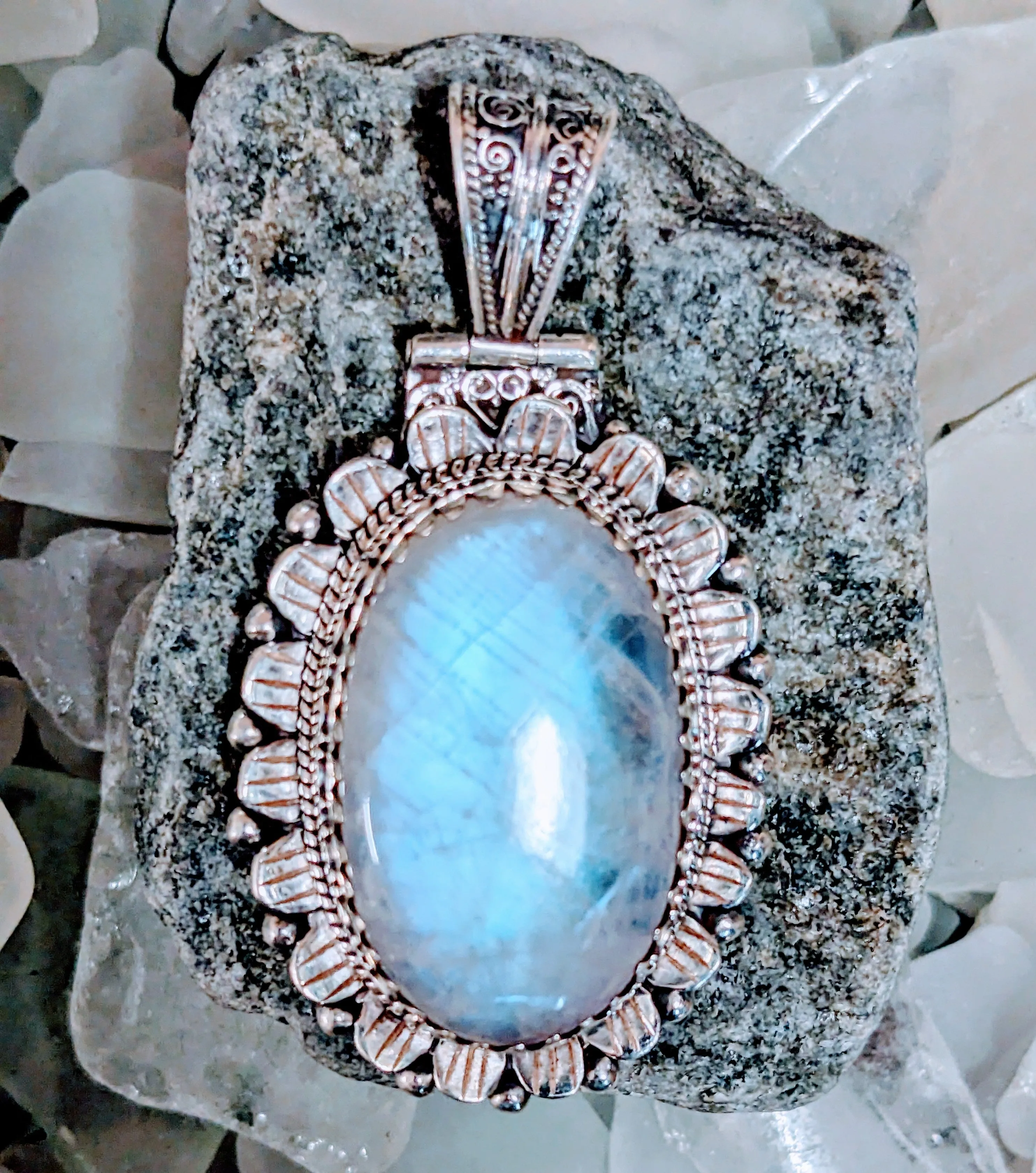 Illuminating Moonstone Pendant with Exquisite Scrollwork